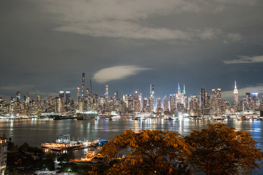 New York City Skyline Reflecting on Hudson River at Night