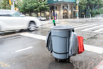 Street cleaner cart waiting on New York City crosswalk