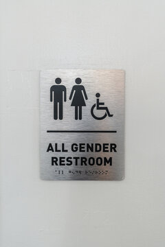 All gender restroom braille sign indicating accessibility for everyone