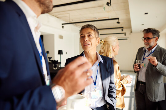 Colleagues talk on coffee break