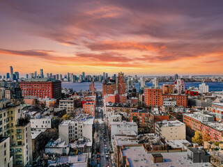 Fototapeta premium Cityscape at sunset, vibrant colors paint the urban landscape.