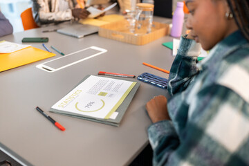 Marketing team analyzing statistics report in coworking office meeting