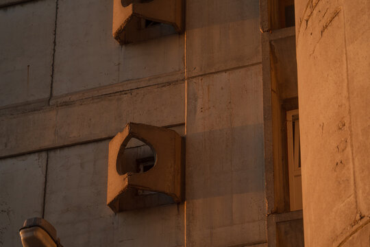 Brutalism socialist architecture buildings of Genex Tower or Western City Gate in New Belgrade Block district at sunset