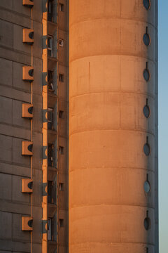 Brutalism socialist architecture buildings of Genex Tower or Western City Gate in New Belgrade Block district at sunset