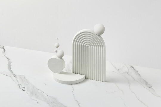 Geometric design with soft curves and spheres on marble background