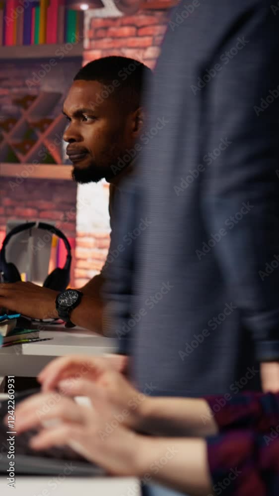 Fototapete vertical video irked man punching startup office desk in frustration struggling to fix application e