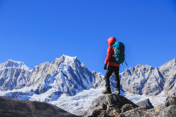 Fototapeta premium Successful woman hiker on high altitude mountain top
