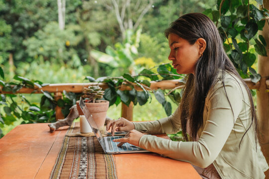 Woman telework with his laptop in nature