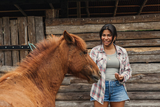 Countryside latina woman and horse