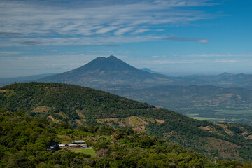 Panoramic wide angle view of San Vicente volcano from a lookout located between small towns Berlin and Alegria in El Salvador. Sunny day, blue sky.