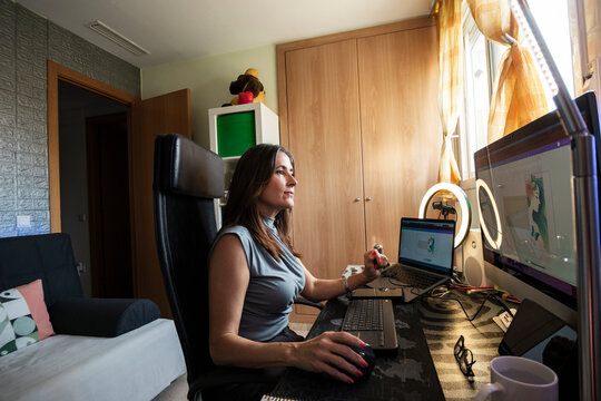 Woman working in organized home office