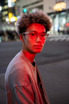 Urban portrait of stylish young man at night