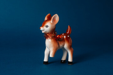 baby deer figurine with a broken leg