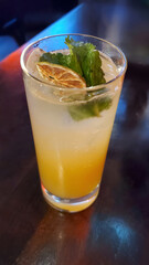A tropical cocktail on a dark wooden bar table, drinks, bar, cocktail, alcohol