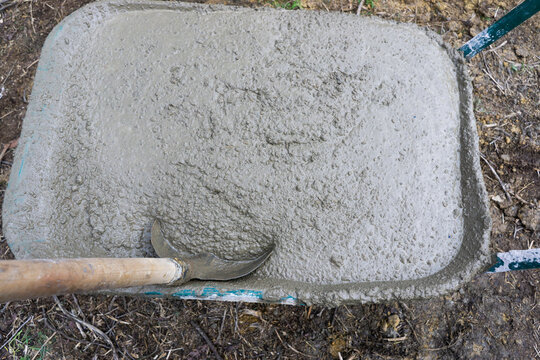Concret in a wheelbarrow.