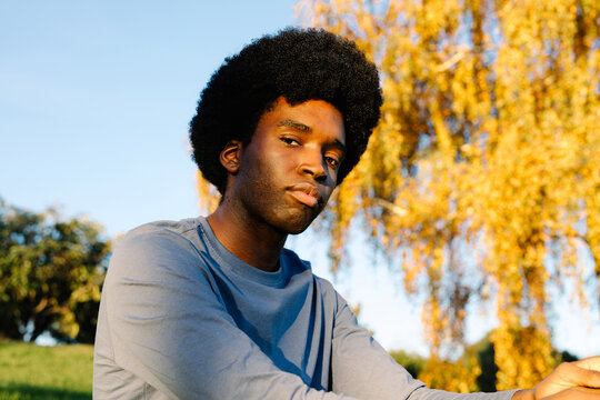 Outdoor portrait of a man looking at camera with an empowered attitude