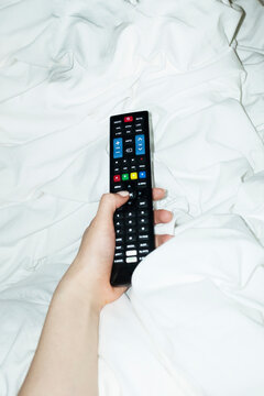 Pov/point of view of person switching on and watching tv television 