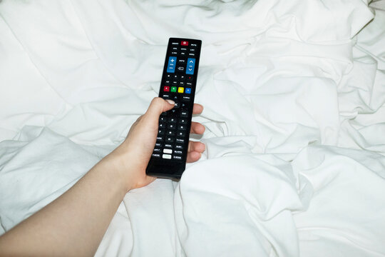 Pov/point of view of person switching on and watching tv television 