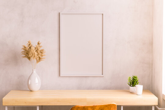 Minimalist Workspace with Framed Wall and Natural Decor