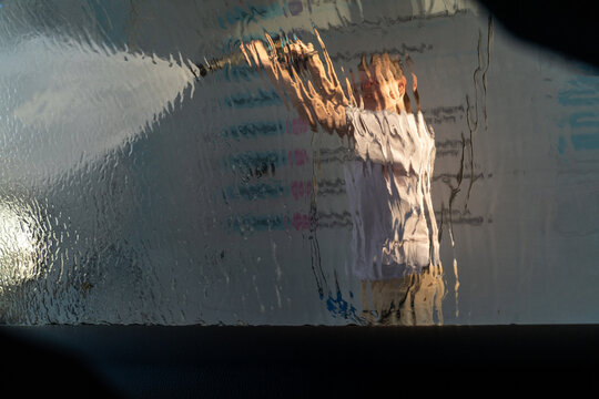 Distorted Reflection Through Wet Glass