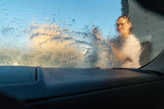 View Through Car Windshield During Washing