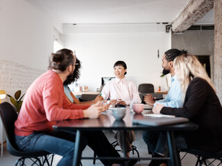 Collaborative Team Meeting in a Modern Office Setting