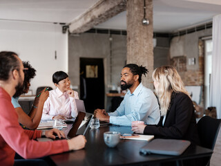 Diverse Team Engaged In A Collaborative Office Meeting Discussion