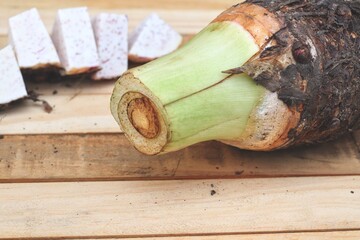 Fresh taro raw on wood background