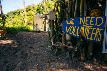 "We need volunteers" Sign
