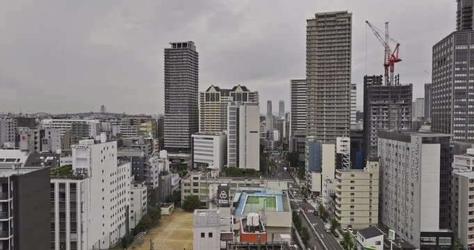 Osaka Japan Aerial v127 drone low flyover Motomachi and Minatomachi capturing densely packed urban cityscape of Naniwa and Nishi ward under an overcast sky - Shot with Mavic 3 Pro Cine - Oct 10th 2023