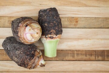 Fresh taro raw on wood background