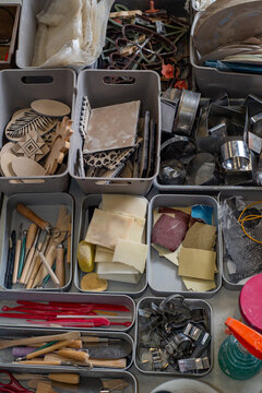 Top view of tools, brushes and materials in an artist's workshop