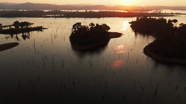 drone sunset above Tranquil aerial enchanted forest of a serene natural landscape still water reflecting the twilight sky