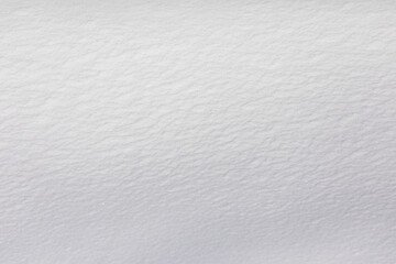Fototapeta premium Background Texture of powdery snow, pristine white, intact, in the morning light after a heavy snowfall