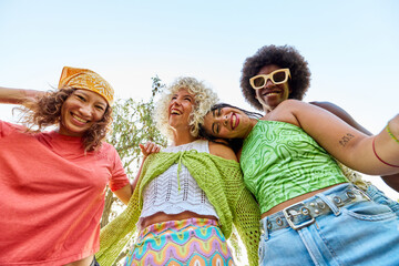 Cheerful diverse women friends hugging