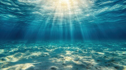 Fototapeta premium Sunbeam illuminating the underwater scene in the ocean with clear blue water