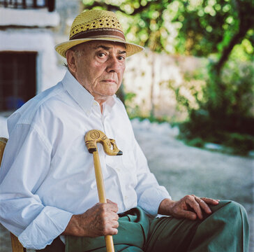Vintage Portrait of an Elderly Man with Cane