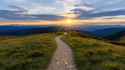 winding mountain trail illuminated by first rays of sunrise