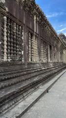 Fototapeta premium Cambodia, Siem Reap - hand carved stone columns in the ancient temple of Angkor Wat