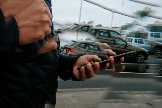 kaleidoscopic image of a man using his smartphone on the street