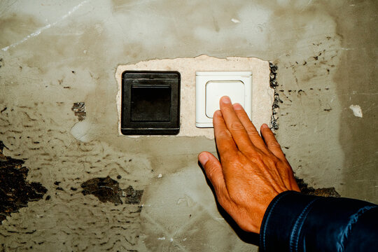 man turning on the light