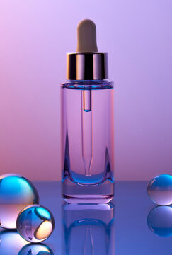 Dropper bottle with glass spheres on gradient purple background. 