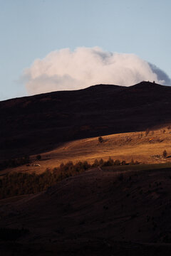 Large puffy cloud in dramatic landscape