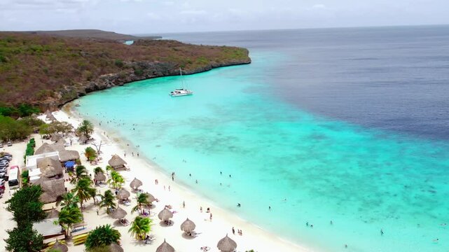 Establishing Aerial Pan of Beautiful Tropical Beach Lagoon with Catamaran