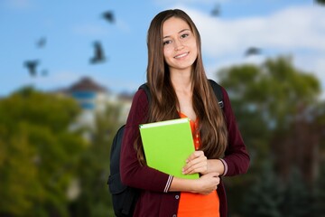 Fototapeta premium Happy young student posing on a campus setting