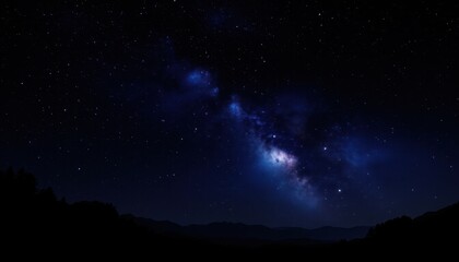 Stunning milky way galaxy with bright stars over dark mountain landscape
