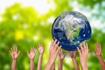 Group of multiethnic people holding earth globe