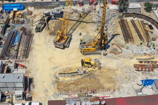 crawler crane, piling machine and concrete mixer at the construction 