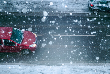 A car on the road during a snow storm 
