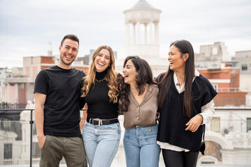 Young entrepreneurs laughing together on a rooftop